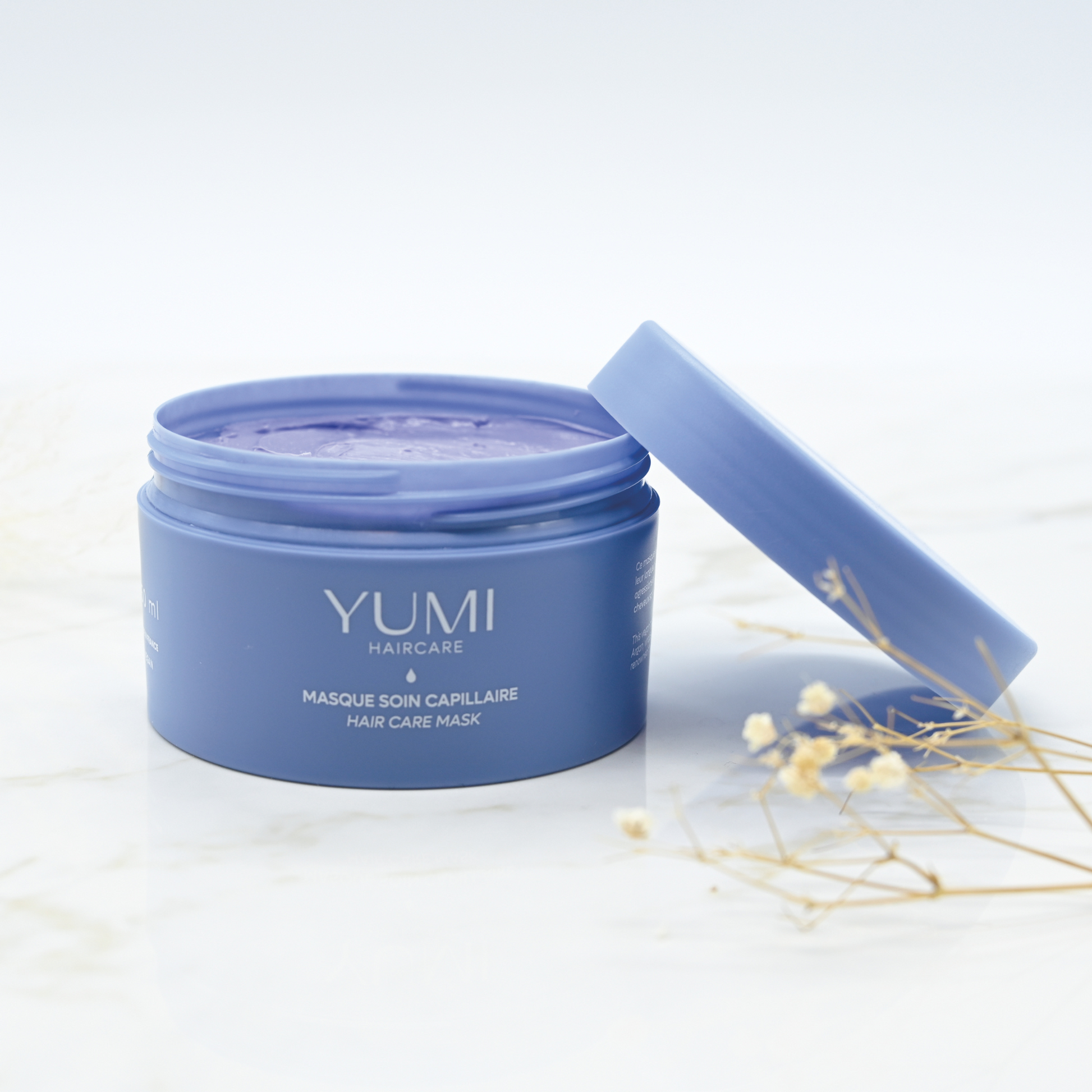 Yumi Haircare Hair Mask in a 250ml bottle, creamy formula for nourishing and repairing damaged hair.
