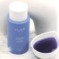 Yumi Haircare sulfate-free shampoo bottle with 250ml capacity, featuring a sleek design and natural hair care branding.