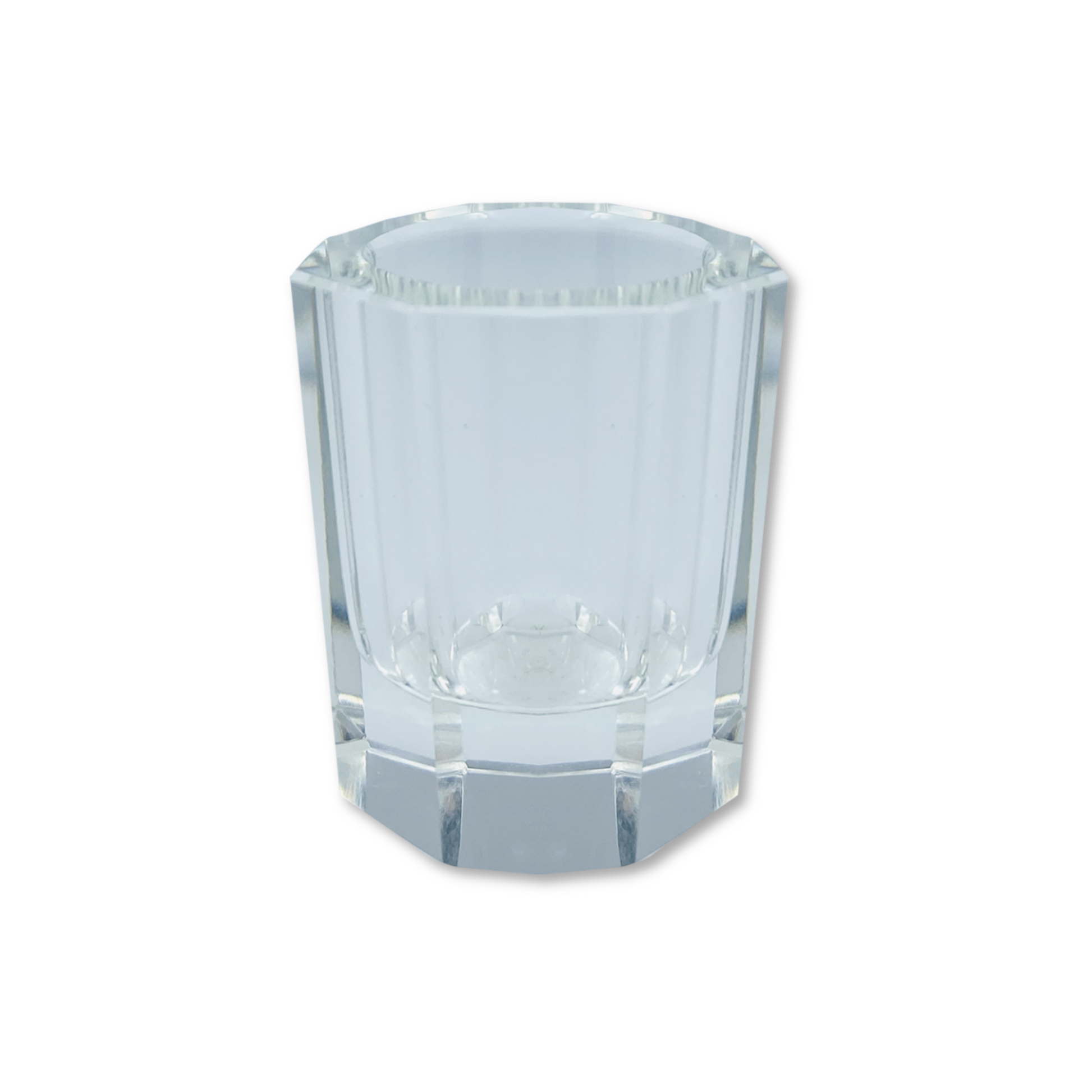 Yumi Lashes & Brows glass cup with Yumi Lashes branding, designed for storing or displaying lash and brow tools.