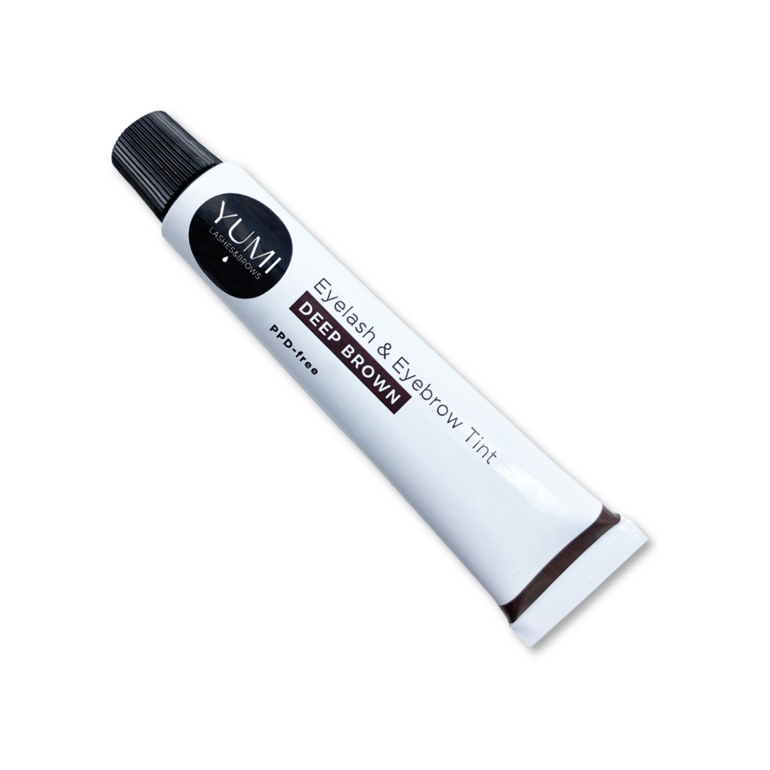 Yumi Lashes & Brows PPD-Free Deep Brown tint kit showing tint applicator and brow area with dark brown tinted lashes and brows