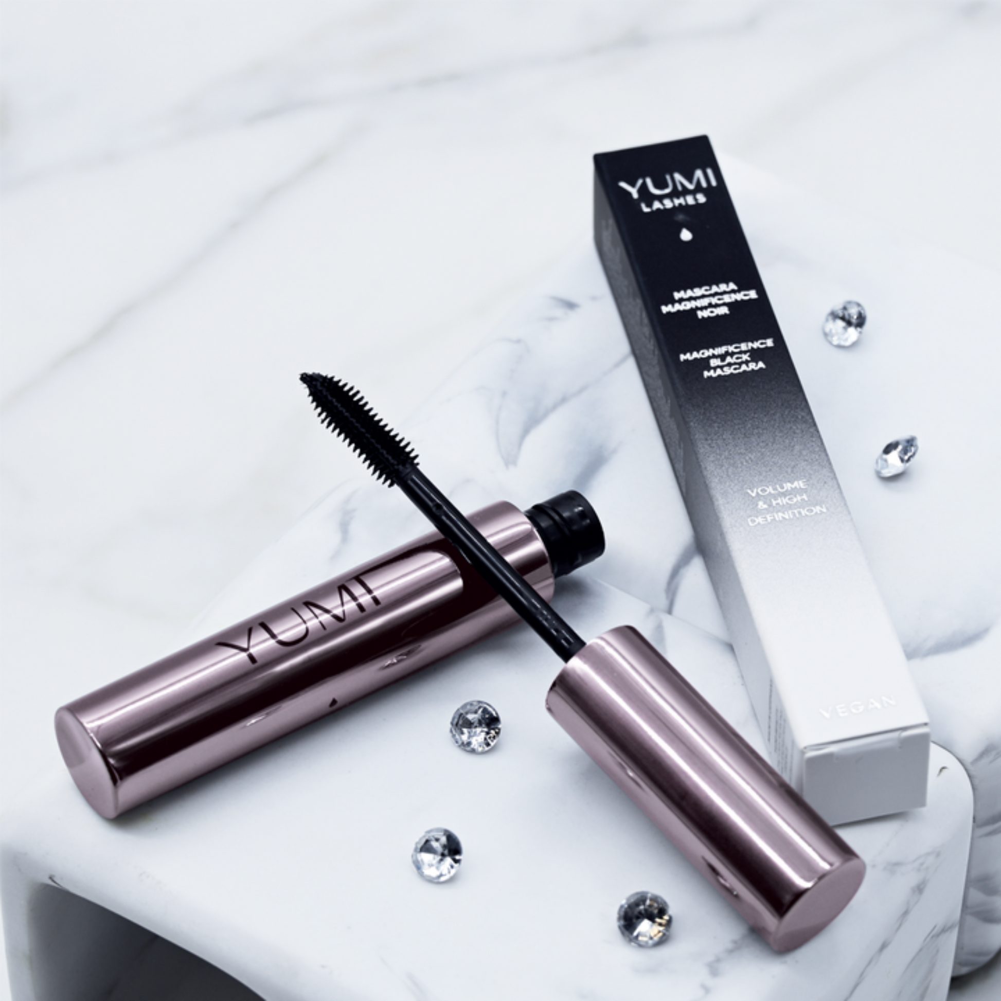 Yumi Beauty Yumi Lashes Magnificence Black Mascara display showing multiple mascara tubes with sleek black packaging