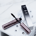 Yumi Lashes Magnificence Black Mascara tube, showcasing sleek packaging and applicator for long, defined lashes.