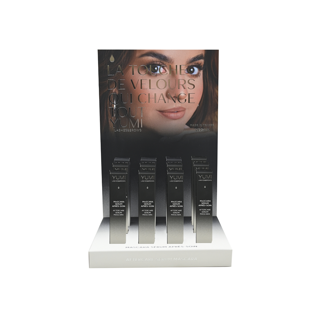 Yumi Lashes nourishing mascara and aftercare serum bundle on display, featuring mascara tubes and serum bottles for lash care.