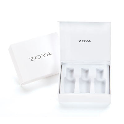 Zoya Dream Box White featuring a collection of nail polish bottles with pastel and neutral shades in a sleek white box.