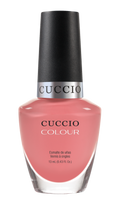 Cuccio Colour All Decked Out nail polish bottle showing vibrant purple shade with label on a white background