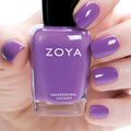 Zoya Tina nail polish bottle with vibrant pink shade, showcasing the Zoya brand and the sleek nail polish packaging.