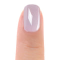 Close-up of Zoya Vickie nail polish bottle with a vibrant, glossy nail polish swatch showing the color on painted nails.