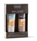 A Cuccio Naturale Butter Essentials gift box containing two tubes of butter & scrub and butter products, with a honey & milk butter description, set against a white background.