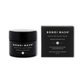 Bondi Wash Purifying Night Balm for anti-aging, displayed in a sleek jar with a smooth, creamy texture and minimalist packaging.