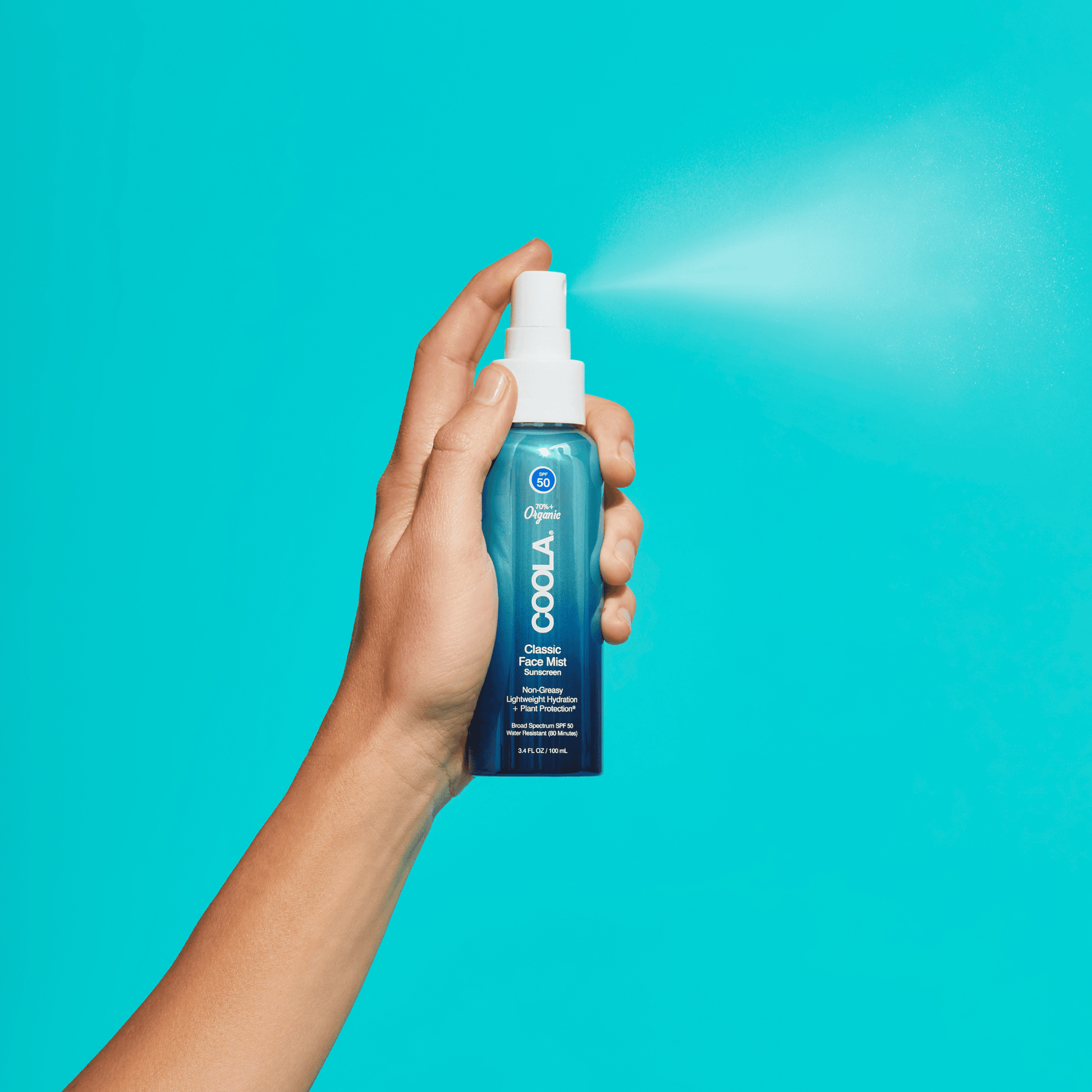 Coola Classic Face Organic Sunscreen Mist SPF50 bottle with white spray cap and clear label, displayed against a plain background.