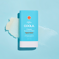 Coola Classic Organic Sunscreen Stick SPF30 with Tropical Coconut scent, showing the portable sunscreen stick in a natural setting