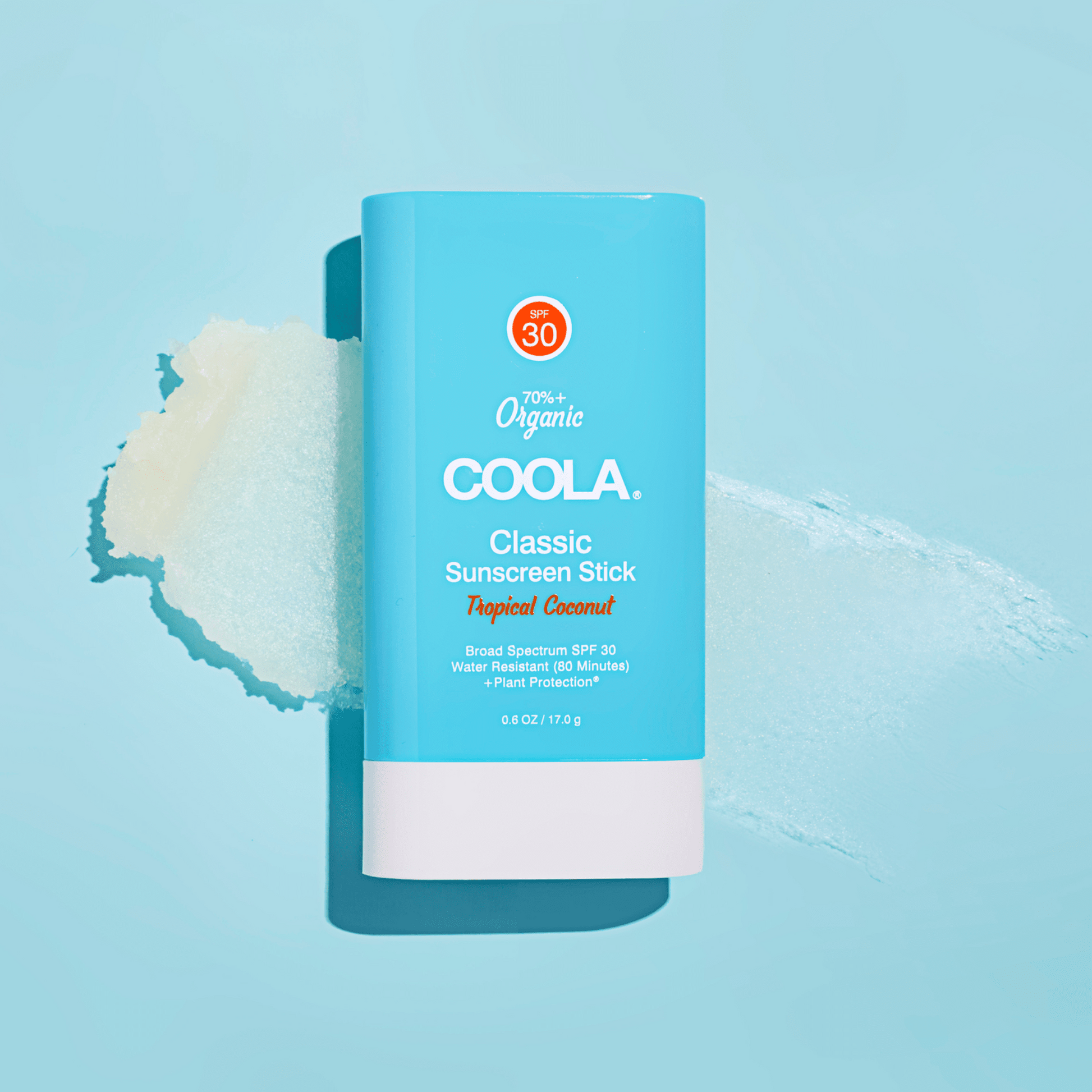 Coola Classic Organic Sunscreen Stick SPF30 with Tropical Coconut scent, showing the portable sunscreen stick in a natural setting