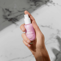 Coola Dew Good Illuminating Face Serum SPF30 in a sleek bottle, showing the moisturizer's brightening and sun protection features.