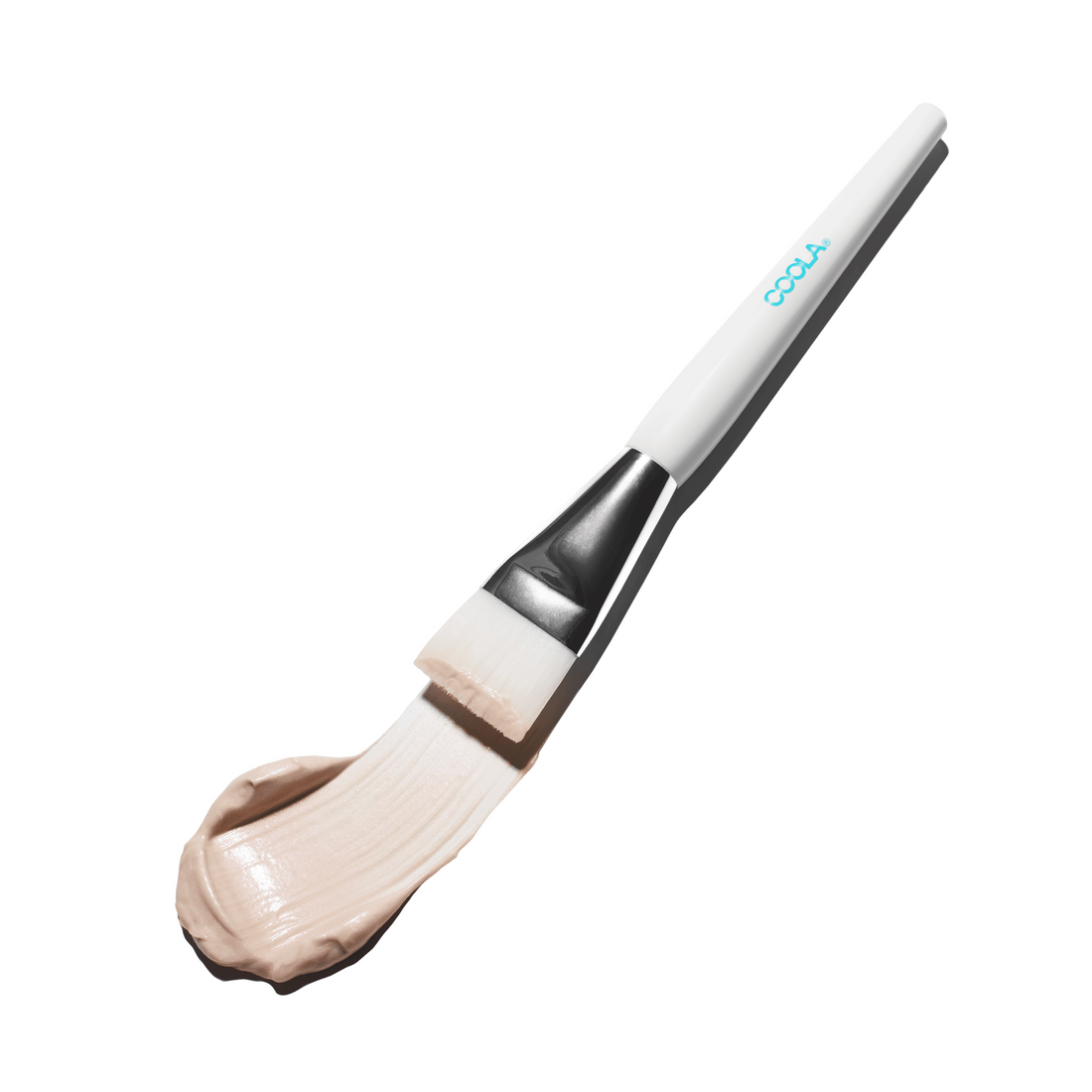 Coola Suncare facial mask brush with soft bristles for skincare, designed for applying and blending facial masks effectively.