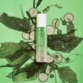Coola Glowing Greens Detoxifying Facial Cleansing Gel from Coola Suncare, showing a tube of facial cleanser with green branding.