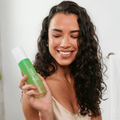 Coola Glowing Greens Detoxifying Facial Cleansing Gel in a clear tube with green accents, designed for deep cleansing and refreshment.