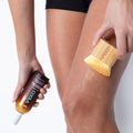 Coola Organic Sunless Tan Kabuki Body Brush for self-tanning, with soft bristles and natural wood handle.