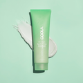 Coola Pacific Polish gentle sea salt facial exfoliator in a jar, showcasing natural ingredients and texture for smooth skin.