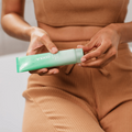 Coola Pacific Polish gentle sea salt facial exfoliator in a jar, showing the natural sea salt texture and calming packaging.