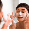 Coola Pacific Polish gentle sea salt facial exfoliator in a jar, natural face scrub by Coola Suncare with sea salt texture.