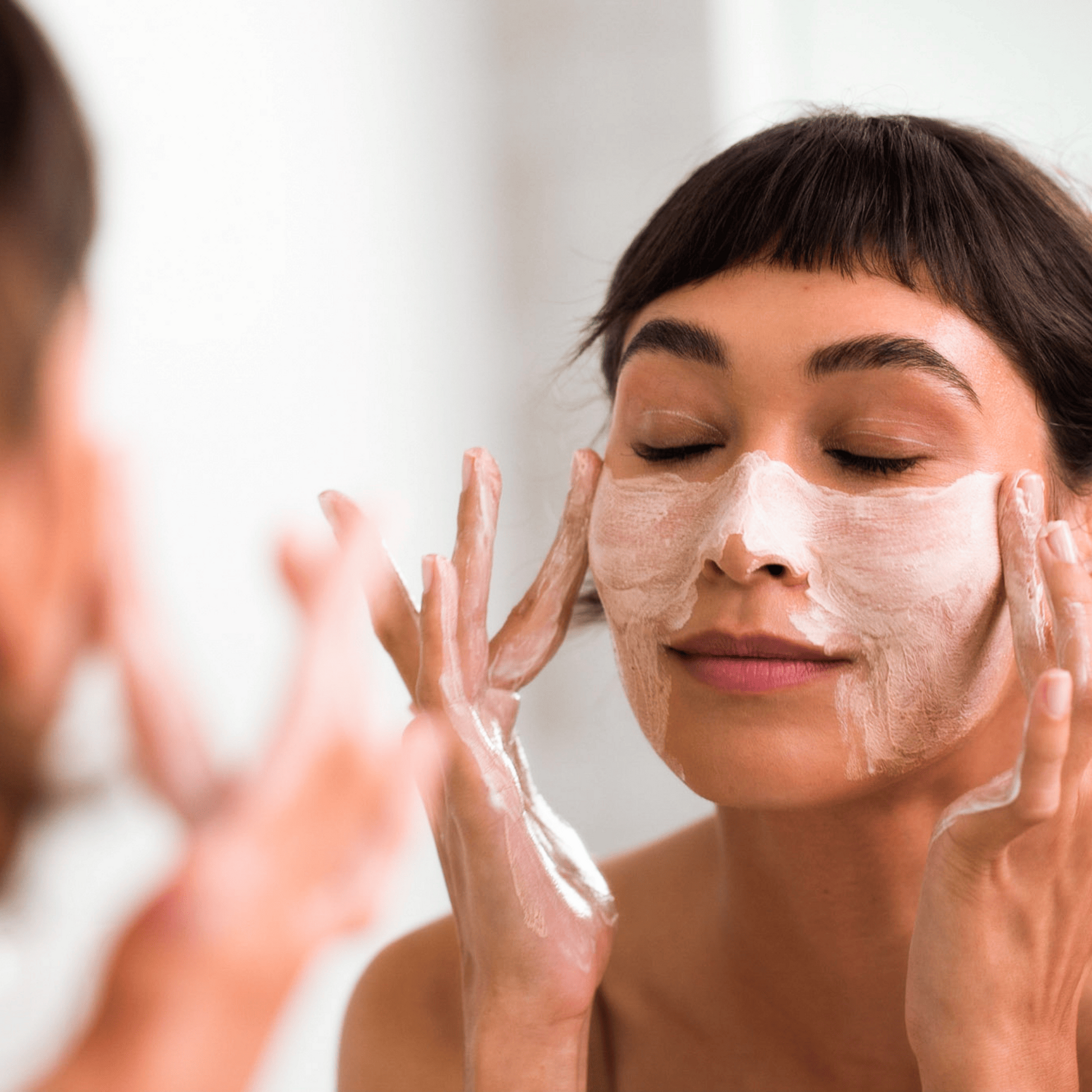 Coola Pacific Polish gentle sea salt facial exfoliator in a jar, natural face scrub by Coola Suncare with sea salt texture.