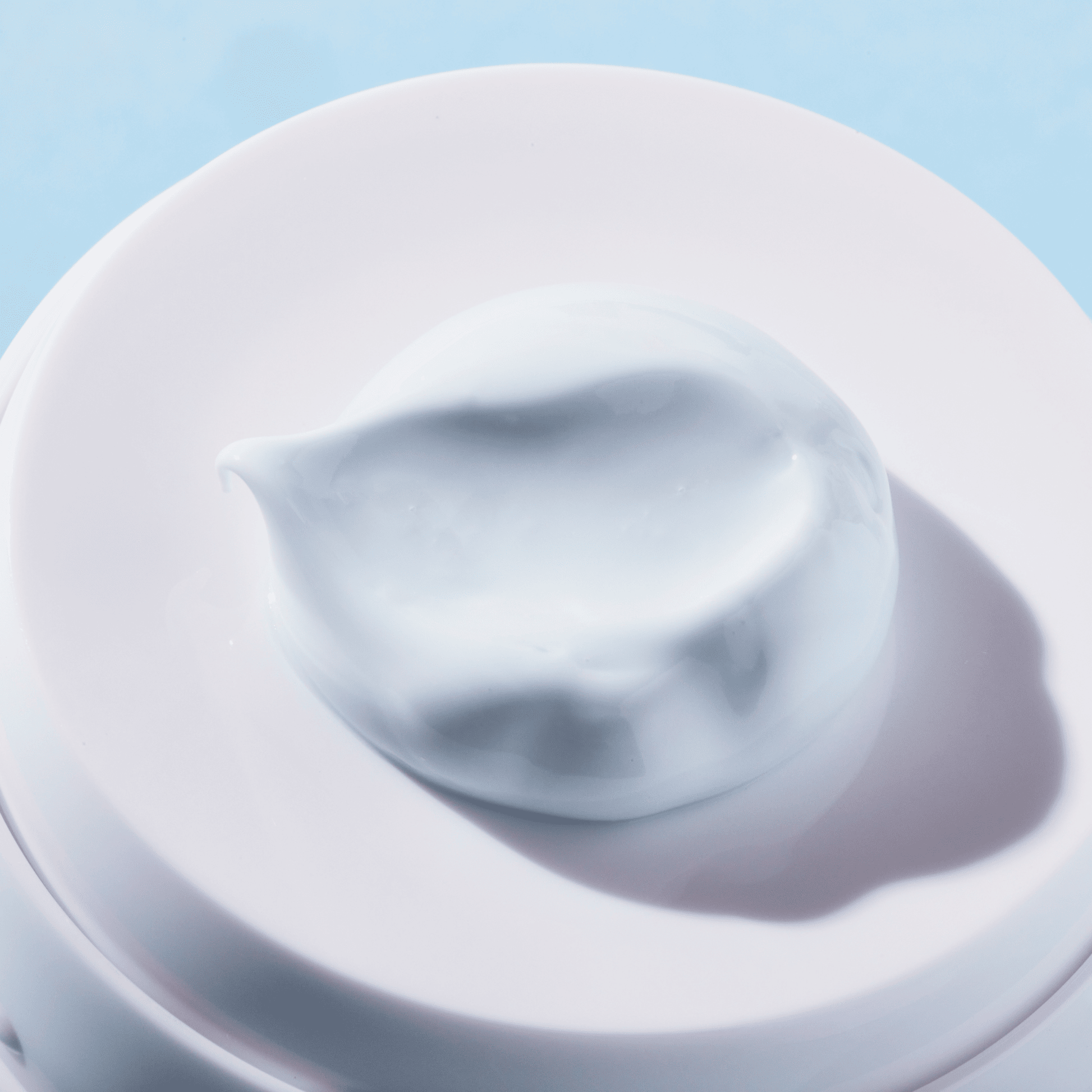 Coola Refreshing Water Cream organic face sunscreen SPF 50 in a white lotion bottle with a pump dispenser.