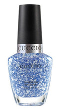 Cuccio Colour All The Rave nail polish bottle featuring vibrant, multicolored nail polish on a white background.