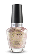 Cuccio Colour chemical attraction nail polish in vibrant shade, showcased on a nail polish bottle with colorful packaging.