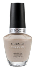 Cuccio Colour nail polish in Colour Cream & Sugar, a vibrant cream-colored gel polish, displayed on a neutral background.