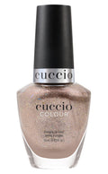 Cuccio Colour Dreamville nail polish bottle with colorful label, displaying vibrant nail polish shades.