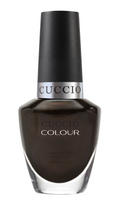 Cuccio Colour Duke It Out nail polish bottle showcasing vibrant purple shade, part of Cuccio Colour nail polish collection.