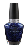Cuccio Colour Gala nail polishes in vibrant shades, displayed in a row with their colorful bottles.