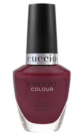 Cuccio Colour Laying Around nail polish bottle from Cuccio Colour collection with vibrant pink shade and glossy finish.
