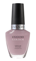Cuccio Colour Longing for London nail polish bottle, pink and purple shades, with product label visible.