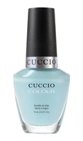 Cuccio Colour Meet Me in Mykonos nail polish bottle with colorful label, showcasing vibrant pink and purple shades.