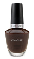 Cuccio Colour French pressed for time nail polish bottle with pastel pink shade and sleek packaging.