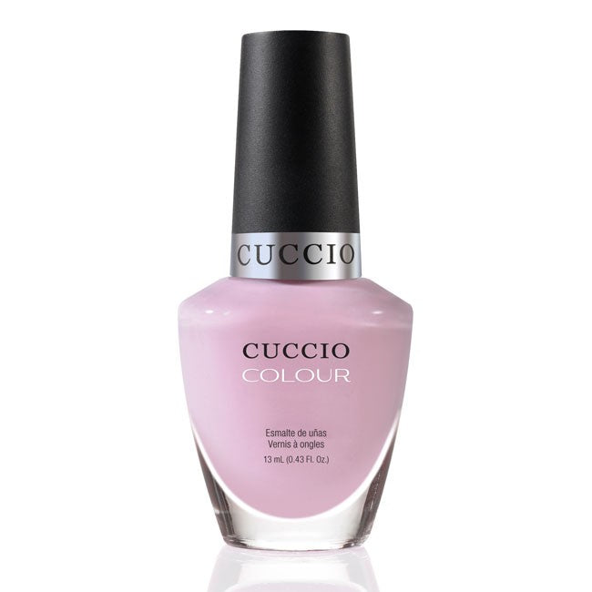 Cuccio Colour Namaste nail polish bottle with vibrant purple color and sleek packaging, showcasing the Cuccio Colour brand.
