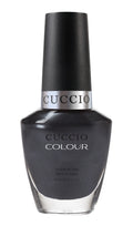 Cuccio Colour Oh My Prague nail polish bottle with vibrant purple shade and sleek packaging.