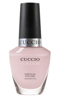 Cuccio Colour Pretty Pink Tutu nail polish bottle with pink cap, showcasing vibrant pink color and sleek design.
