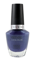 Purple Rain nail polish from Cuccio Colour in Spain, featuring a vibrant purple shade with a glossy finish.
