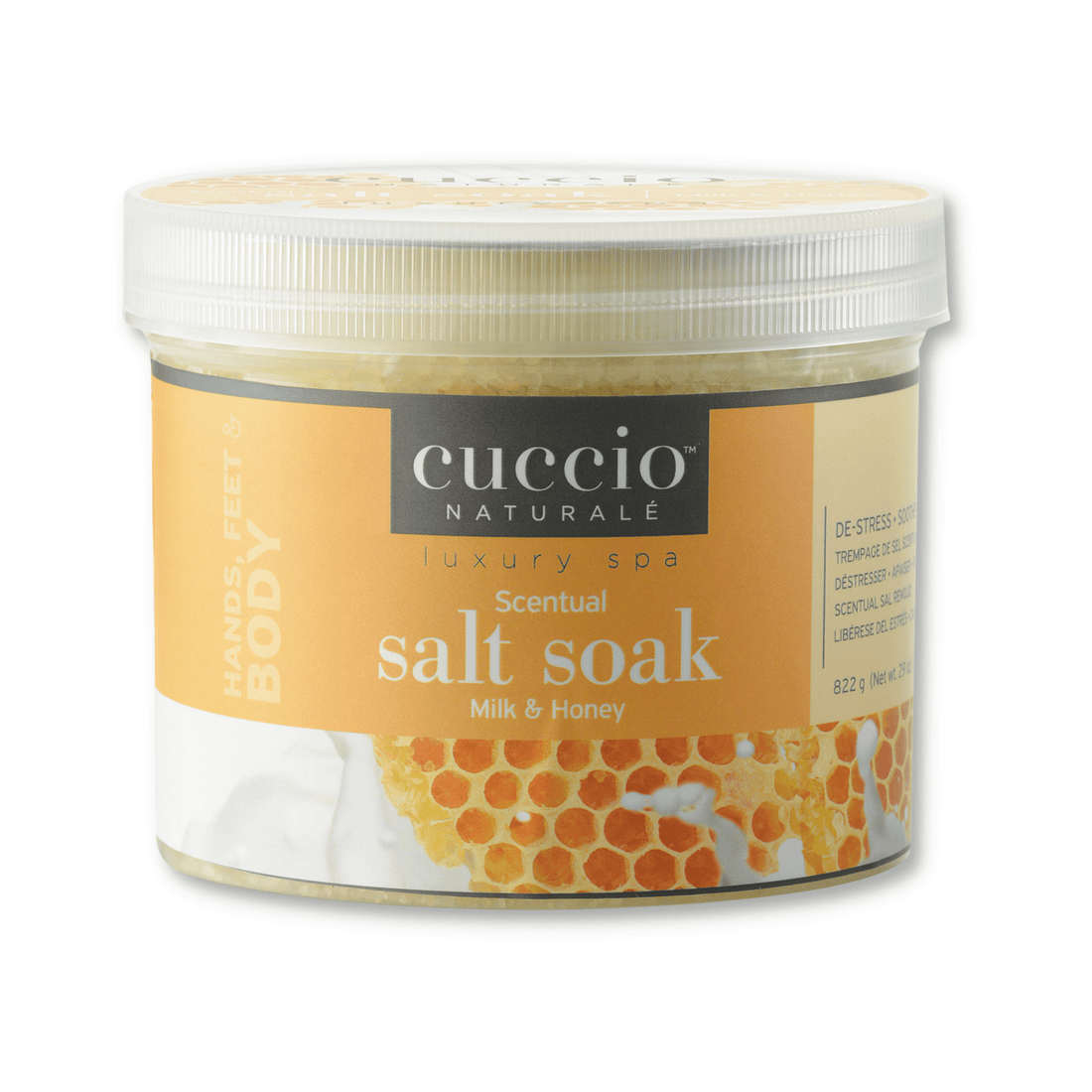 Cuccio Naturalé Scentual Salt Soak with milk and honey scent, showing a jar of relaxing bath salts with a label and a wooden scoop.