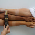 Eco by Sonya Driver Hempitan Body Tan Water self-tanner bottle with pump and tan water inside, natural skincare product for a sun-kissed glow.