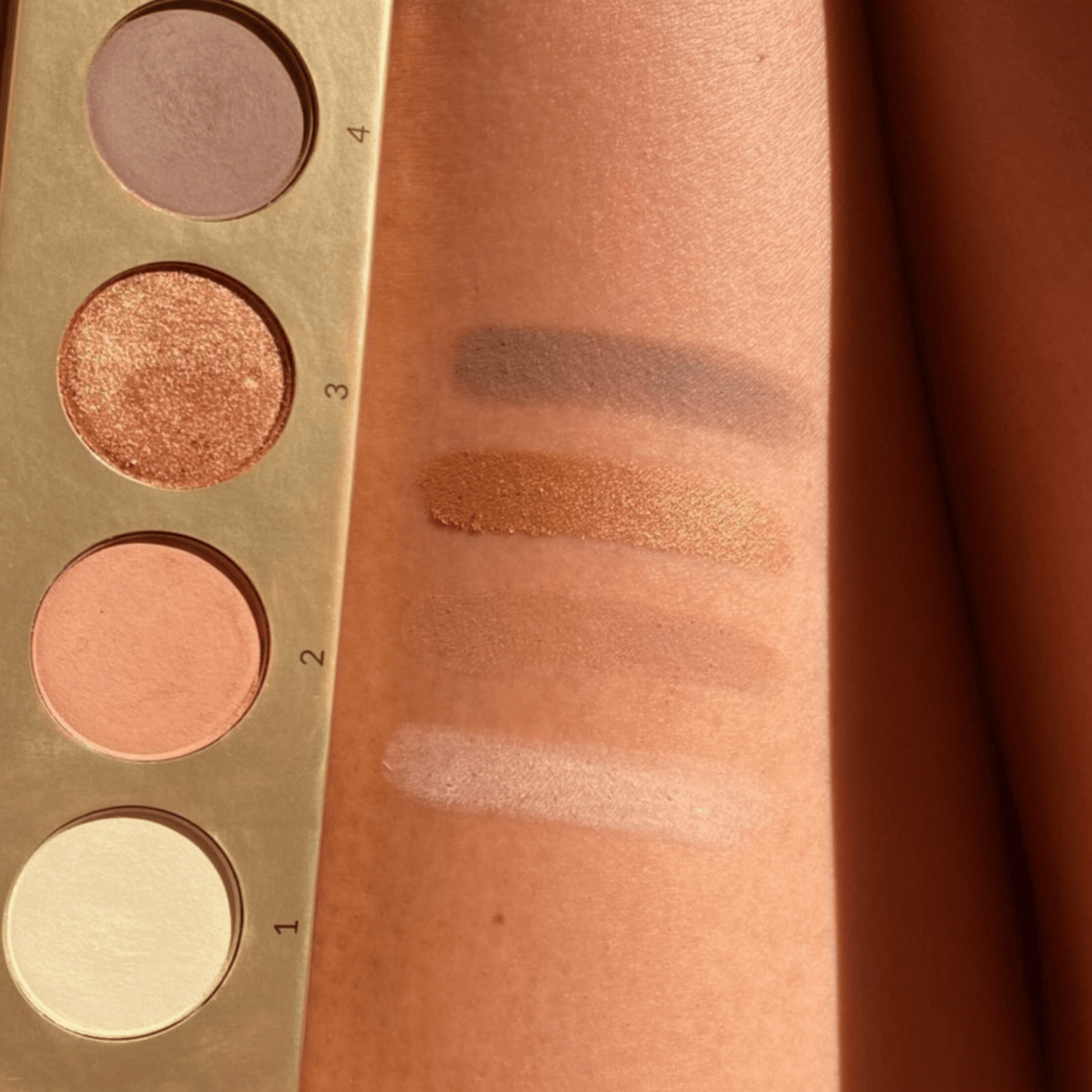 Eco by Sonya Driver makeup set featuring a signature palette with eyeshadows, blush, and highlighters in a sleek compact.