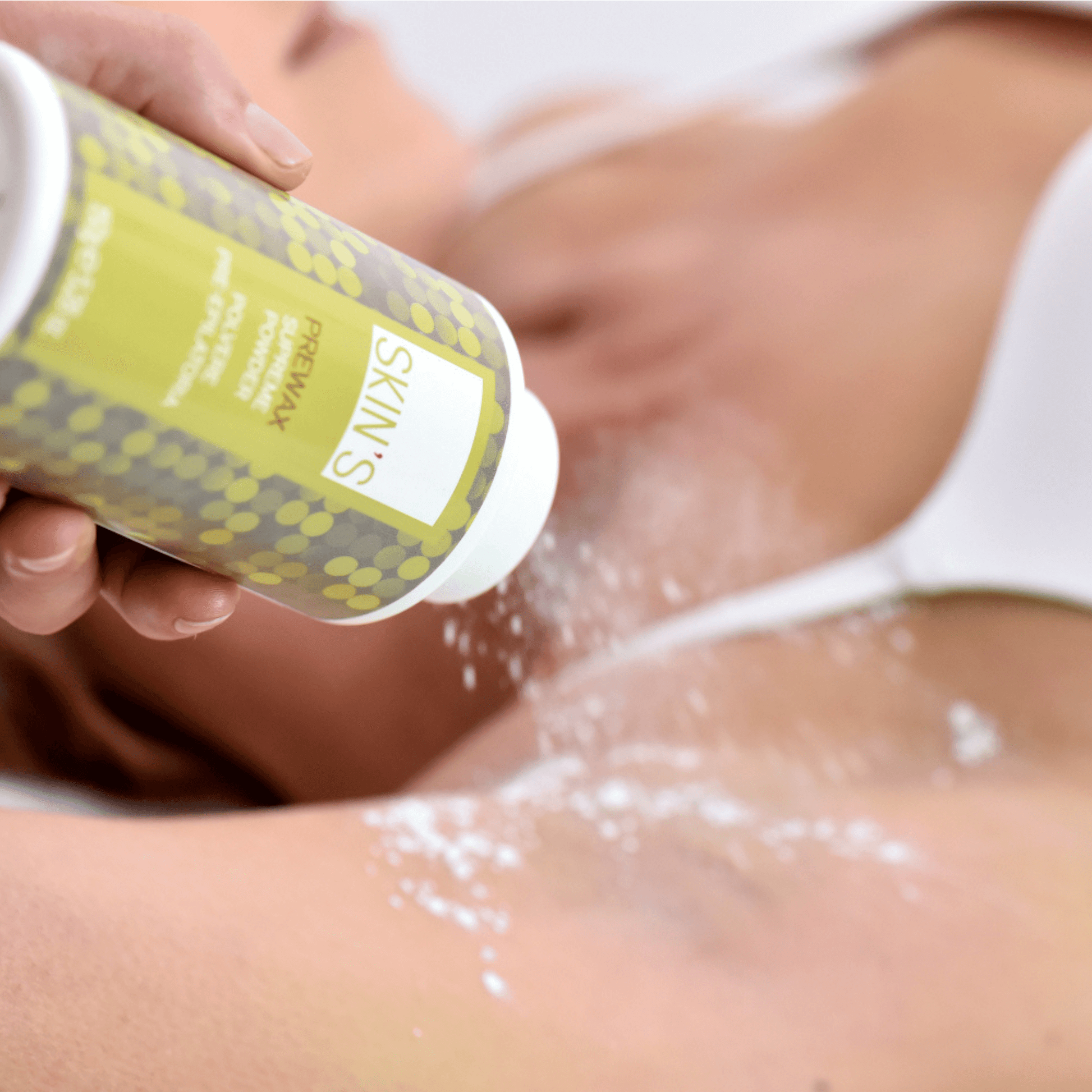 SKIN'S Prewax Supreme Powder for epilation, fine white powder in a container, used to prepare skin for waxing treatments.