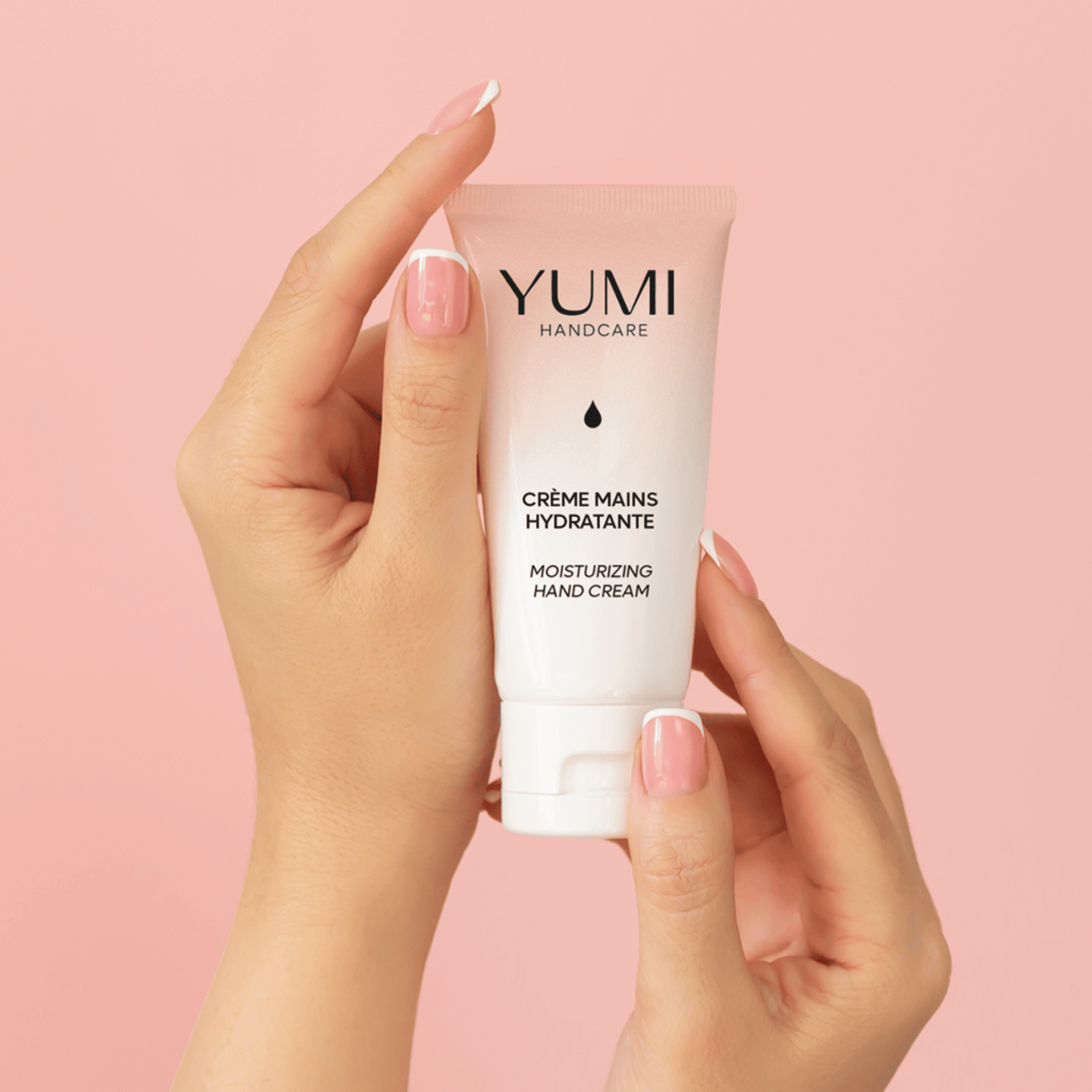 Yumi Handcare moisturizing hand cream tube with a soft, creamy texture and floral design on the packaging.