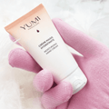 Yumi Handcare Moisturizing Hand Cream tube with white and pink packaging, designed for soft, hydrated hands.
