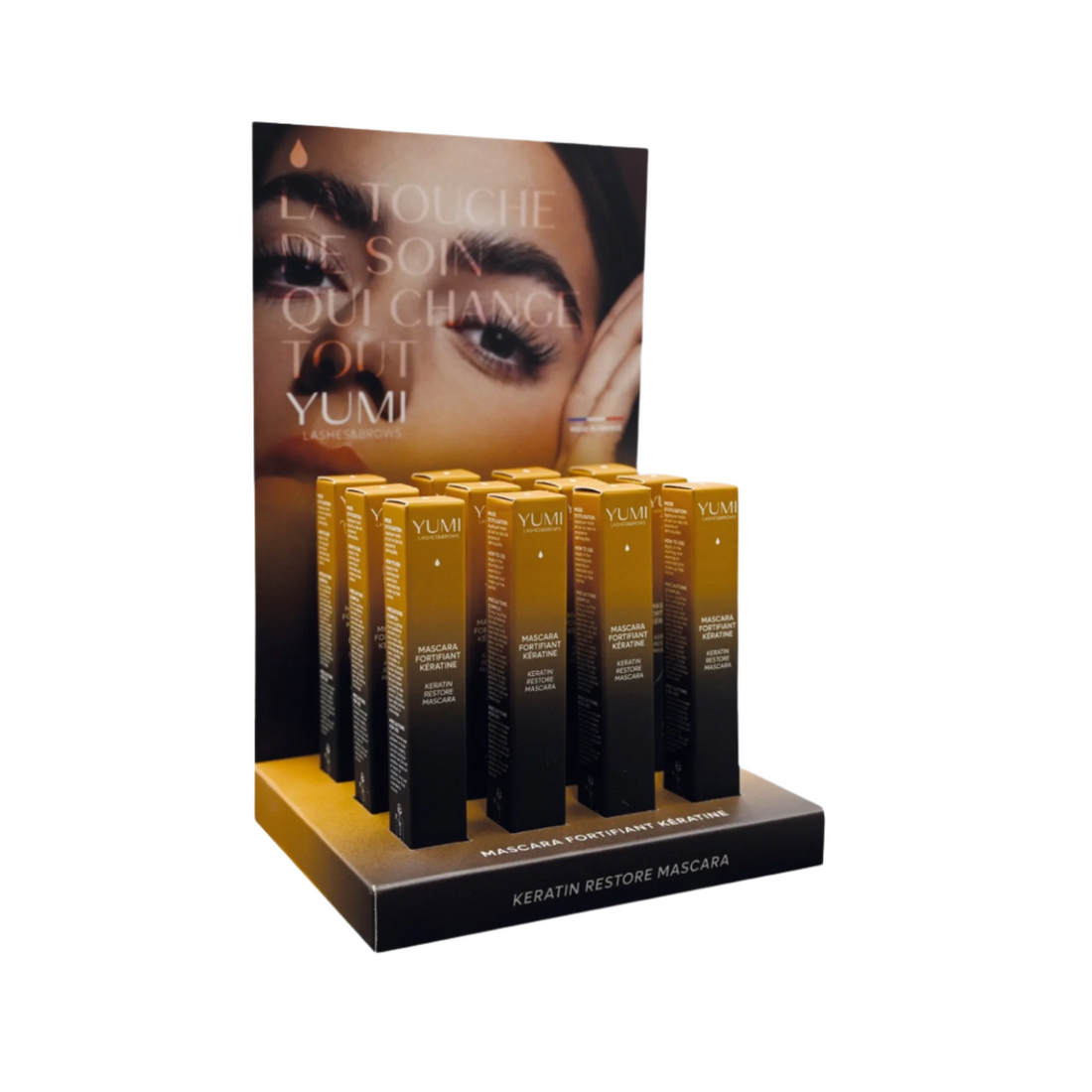 Yumi Lashes Keratine Restore Mascara bundle display showing multiple mascara tubes with black and gold packaging