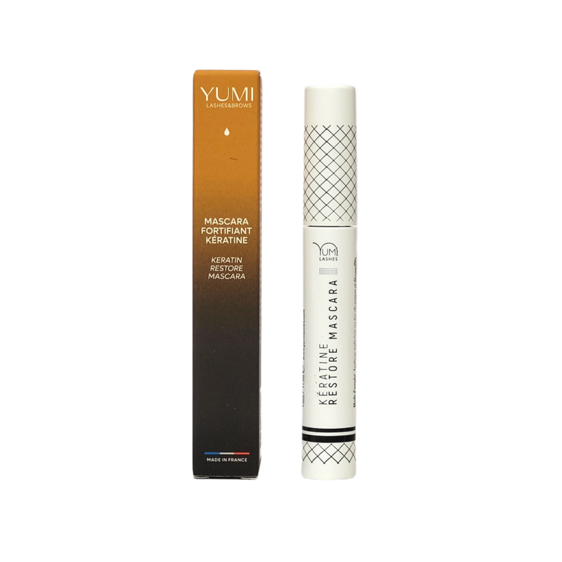 Yumi Lashes Keratine Restore Mascara tube with a black lid and sleek packaging, designed to enhance and restore lash health.