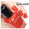 Zoya Aphrodite nail polish bottle with a sleek design, showcasing the vibrant pink shade in a close-up shot.