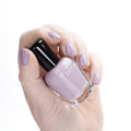 Zoya Birch nail polish bottle with white cap and clear glass showing light beige nail polish color.